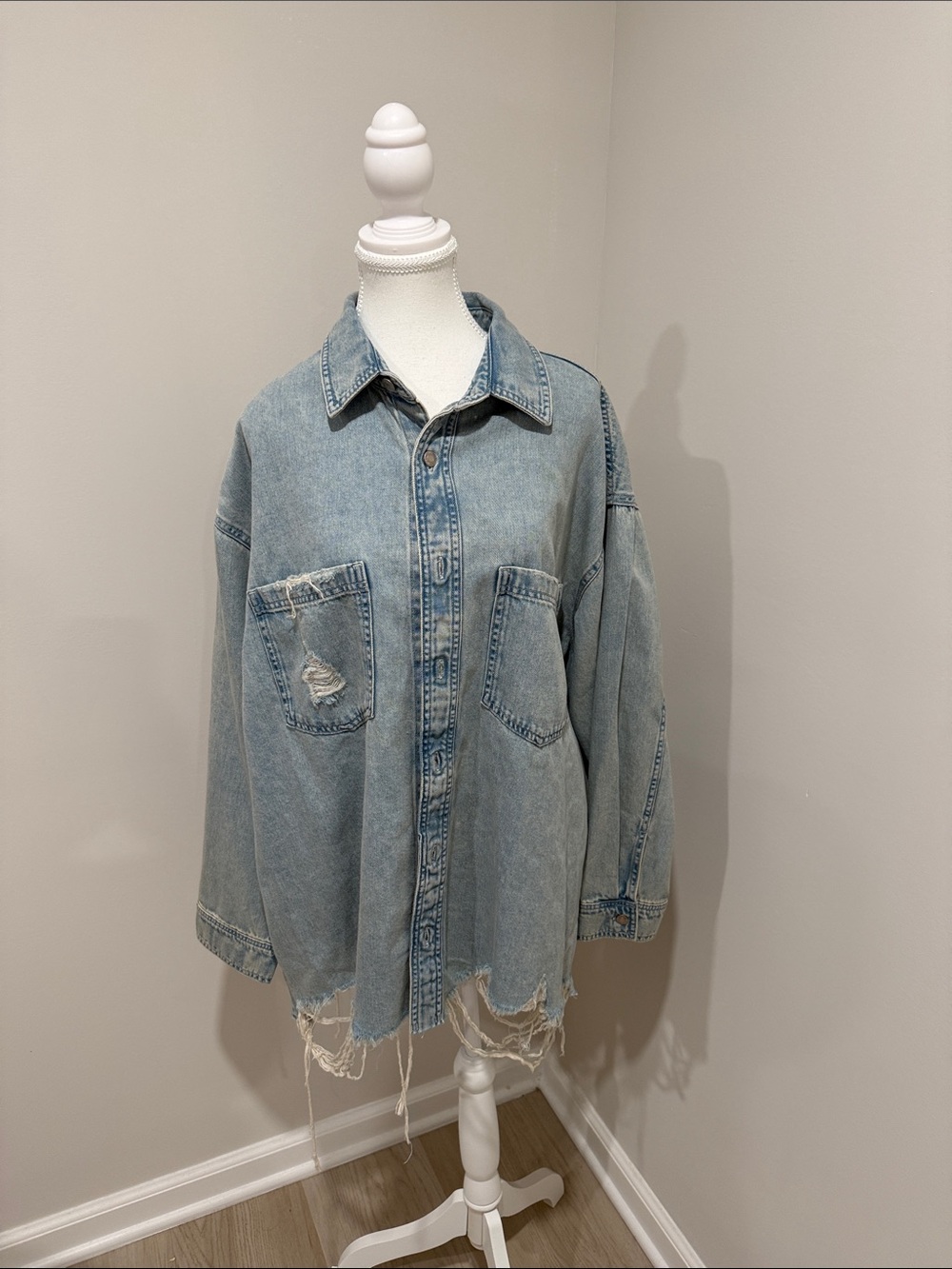 Woman’s Light Blue Distressed Denim Shirt Jacket